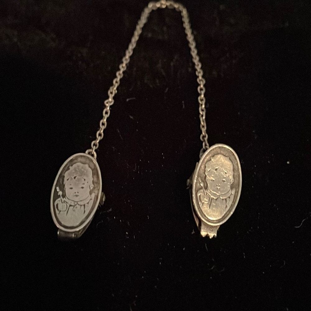 Antique silver baby bib holder
